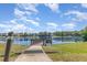 Scenic community lake with wooden dock offering stunning views and recreational opportunities at 729 Secret Harbor Ln # 105, Lake Mary, FL 32746