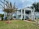 Inviting two-story condo with well-maintained lawn and appealing blue and white exterior paint at 729 Secret Harbor Ln # 105, Lake Mary, FL 32746
