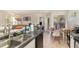 Open view from the kitchen into the spacious living and dining area filled with sunlight at 729 Secret Harbor Ln # 105, Lake Mary, FL 32746
