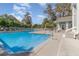 Large community pool with a shallow end, ideal for cooling off and relaxing in the sun with convenient laundry access at 729 Secret Harbor Ln # 105, Lake Mary, FL 32746