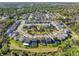 An aerial perspective of a neighborhood displaying homes with manicured lawns and a community park at 753 Daybreak Pl, Longwood, FL 32750