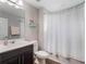 Clean bathroom with a shower and a dark vanity at 753 Daybreak Pl, Longwood, FL 32750