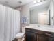 Bright bathroom featuring a shower and a dark vanity at 753 Daybreak Pl, Longwood, FL 32750