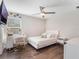 Bright bedroom featuring a modern vanity, white furniture, and a ceiling fan at 753 Daybreak Pl, Longwood, FL 32750