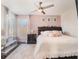 Charming bedroom featuring pink accents, floral decor, and natural light at 753 Daybreak Pl, Longwood, FL 32750