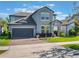 Charming two-story home featuring a well-manicured lawn, brick driveway, and attached two-car garage at 753 Daybreak Pl, Longwood, FL 32750