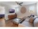 Cozy living room with modern furnishings, a TV, and plenty of natural light from windows at 753 Daybreak Pl, Longwood, FL 32750