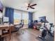 Home office with wood floors, fan and two desks at 753 Daybreak Pl, Longwood, FL 32750