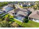 Aerial shot showcasing a screened pool and patio in a fenced backyard with green grass at 753 Daybreak Pl, Longwood, FL 32750