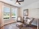 Sun-filled sitting room with comfortable chairs, decorative rug and bright natural light at 753 Daybreak Pl, Longwood, FL 32750