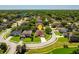 Aerial view of a lovely home in a neighborhood nestled among mature trees and water feature at 755 Country Charm Cir, Oviedo, FL 32765