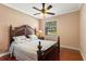 Bedroom featuring a dark wood bed frame and hardwood floors at 755 Country Charm Cir, Oviedo, FL 32765