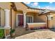 Inviting front porch with brick pavers, decorative columns, and colorful flower accents for added curb appeal at 755 Country Charm Cir, Oviedo, FL 32765