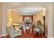 Cozy living room with hardwood floors, archways, and neutral tones that create a bright and inviting atmosphere at 755 Country Charm Cir, Oviedo, FL 32765