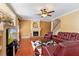 Cozy living room featuring a fireplace, hardwood floors, and comfortable seating arrangement at 755 Country Charm Cir, Oviedo, FL 32765