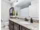 Bathroom with a single sink vanity with granite countertop at 8066 Bowery Dr, Winter Garden, FL 34787