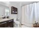 Bathroom featuring a vanity with granite countertop and shower with curtain at 8066 Bowery Dr, Winter Garden, FL 34787