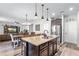 Beautiful kitchen featuring a granite island, stainless steel appliances, and an adjacent dining area for easy entertaining at 8066 Bowery Dr, Winter Garden, FL 34787