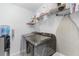 Laundry room with a full size washer and dryer, and shelving at 8066 Bowery Dr, Winter Garden, FL 34787