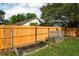 Fenced backyard featuring garden beds for planting and gardening in a sun-drenched outdoor space at 9400 Southern Garden Cir, Altamonte Springs, FL 32714