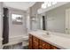 Bathroom featuring a tub and shower combination, modern fixtures, and a wood vanity at 9400 Southern Garden Cir, Altamonte Springs, FL 32714