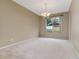 Dining room with carpet, a window for natural light, and neutral paint to make the room inviting at 9400 Southern Garden Cir, Altamonte Springs, FL 32714