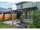 Exterior view of a home featuring a pergola and lush landscaping in the backyard at 9400 Southern Garden Cir, Altamonte Springs, FL 32714