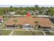 Bird's eye view of a cozy single-story home in a manicured neighborhood with tropical landscaping and mature trees at 1001 Plantation Dr # D5, Kissimmee, FL 34741