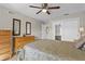 Bedroom with wood furniture, sliding door closet, and natural light at 1001 Plantation Dr # D5, Kissimmee, FL 34741