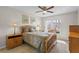 Bright bedroom with wood furniture and lots of natural light at 1001 Plantation Dr # D5, Kissimmee, FL 34741