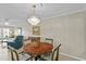 Chandelier illuminated dining room with tile floor and neutral walls at 1001 Plantation Dr # D5, Kissimmee, FL 34741