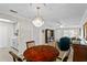 Cozy dining room featuring a classic chandelier and wood table at 1001 Plantation Dr # D5, Kissimmee, FL 34741