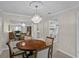 Formal dining area featuring a chandelier and mirrored wall detail at 1001 Plantation Dr # D5, Kissimmee, FL 34741
