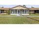 Charming villa with a cozy screened-in porch and manicured front lawn at 1001 Plantation Dr # D5, Kissimmee, FL 34741