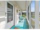 Inviting screened-in porch with seating and a brightly painted floor at 1001 Plantation Dr # D5, Kissimmee, FL 34741