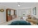 Bright living room featuring a sofa, accent chair, and a built in display cabinet at 1001 Plantation Dr # D5, Kissimmee, FL 34741