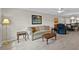 Cozy living room featuring a comfortable sofa and an adjacent dining area at 1001 Plantation Dr # D5, Kissimmee, FL 34741