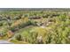 Property with lush greenery and a long driveway leading to a home nestled among the trees at 10115 E Highway 316, Fort Mc Coy, FL 32134