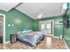 This is a bright bedroom with a ceiling fan, wood-look floors, and a door to the outside at 10115 E Highway 316, Fort Mc Coy, FL 32134