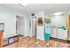 Laundry room with wood look flooring and washer and dryer at 10115 E Highway 316, Fort Mc Coy, FL 32134