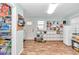 Mud room with wood look flooring, shelving unit, and door to the outside at 10115 E Highway 316, Fort Mc Coy, FL 32134