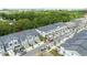Aerial view of modern townhomes in a new development, showcasing the community layout and landscaping at 10443 Ebb Tide Ln, Orlando, FL 32821