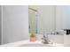 Bathroom vanity with modern faucet and a decorative succulent at 10443 Ebb Tide Ln, Orlando, FL 32821