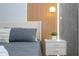 Modern bedroom showcases stylish accent walls, a comfortable bed, and chic nightstand decor at 10443 Ebb Tide Ln, Orlando, FL 32821