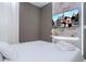 Stylish bedroom with modern wall paneling and a mounted TV for entertainment at 10443 Ebb Tide Ln, Orlando, FL 32821
