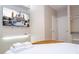 Bright bedroom featuring a large screen TV with Disney castle image, and a serene, comfortable setting at 10443 Ebb Tide Ln, Orlando, FL 32821