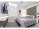 Comfortable primary bedroom with a large TV, ambient lighting and soothing colors at 10443 Ebb Tide Ln, Orlando, FL 32821