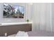 Comfortable bedroom with a TV and decorative accent wall creating a cozy retreat at 10443 Ebb Tide Ln, Orlando, FL 32821