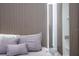 Cozy bedroom with neutral tones and textured headboard details at 10443 Ebb Tide Ln, Orlando, FL 32821