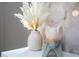 Stylish decor featuring a vase of pampas grass and a unique sculpture at 10443 Ebb Tide Ln, Orlando, FL 32821